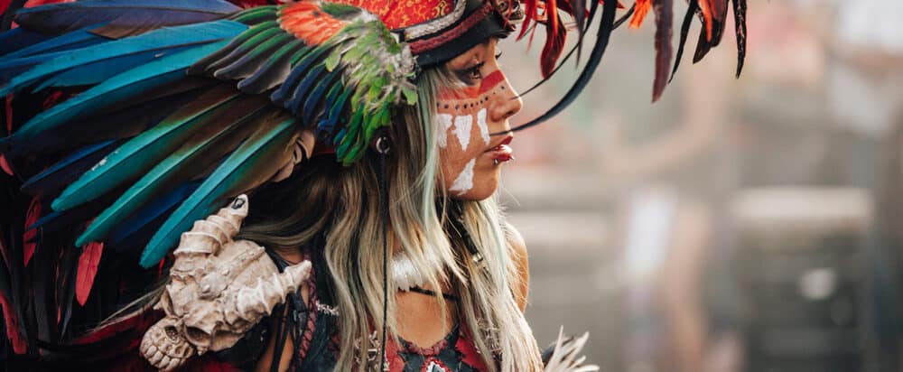 aztec dancers dancing in the zocalo in mexico e1619075728635 1