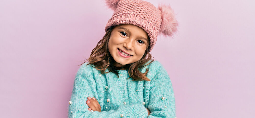 little beautiful girl wearing wool sweater e1618726524144