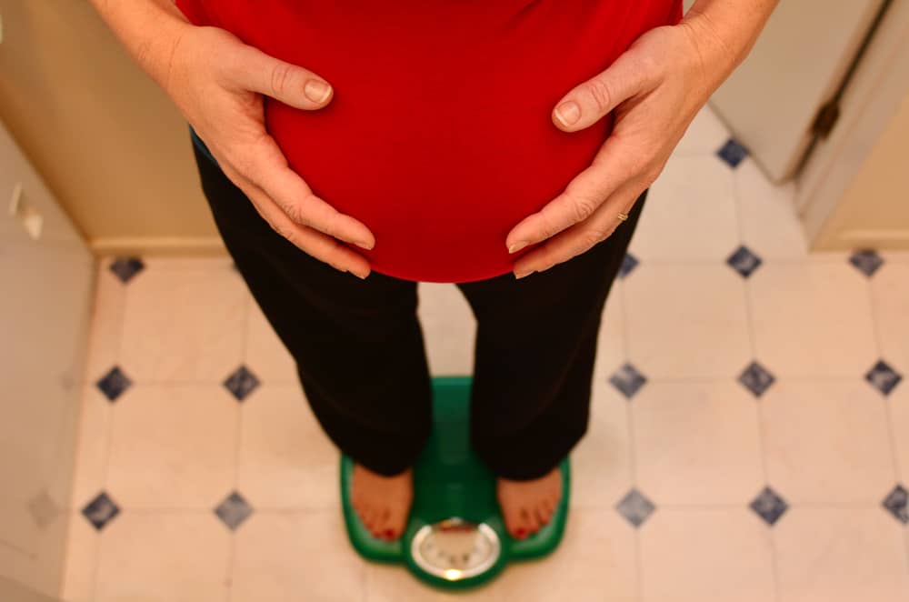 pregnant woman on scales